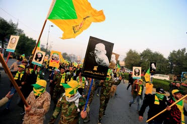 Kata'ib Hezbollah march in Baghdad ahead of the funeral of Abu Mahdi al-Mohandes, January 4, 2020.  (Reuters)