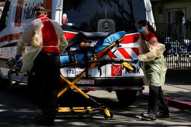 An ambulance crew transports a patient to Gateway Care and Rehabilitation Center in Hayward, California. (Reuters)