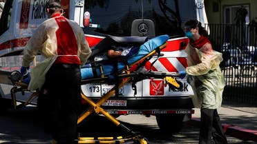 An ambulance crew transports a patient to Gateway Care and Rehabilitation Center, where 7 deaths and 65 confirmed cases of coronavirus disease (COVID-19) among its staff and patients were reported, in Hayward, California. (Reuters)