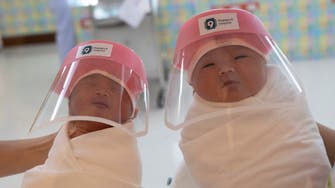 Coronavirus: Newborn babies in Thailand don face shields to protect them from virus