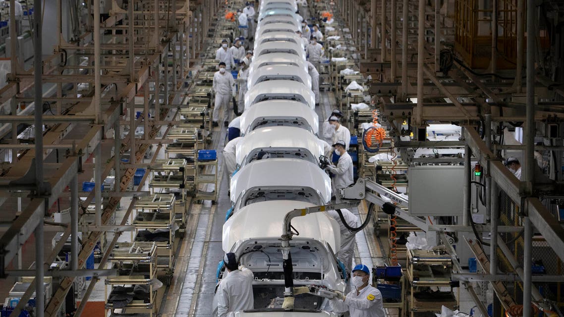 Workers assemble cars at the Dongfeng Honda Automobile Co., Ltd factory in Wuhan in central China's Hubei province on Wednesday, April 8, 2020.