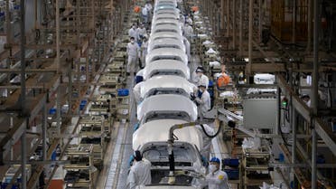 Workers assemble cars at the Dongfeng Honda Automobile Co., Ltd factory in Wuhan in central China's Hubei province on Wednesday, April 8, 2020.  (AP)