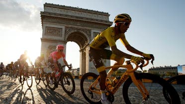 Team INEOS rider Egan Bernal of Colombia, wearing the overall leader's yellow jersey, in action in front of the Arc de Triomphe. (AFP)