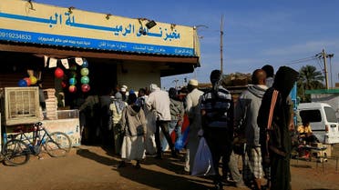 Customers queue to buy bread at a bakery in Khartoum, Sudan February 19, 2020. (Reuters)