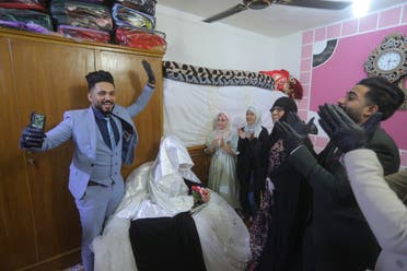 Ahmed Khaled al-Kaabi and his bride Ruqaya Rahim celebrate their wedding in Najaf, Iraq, on Thursday, April 9, 2020. (AP)