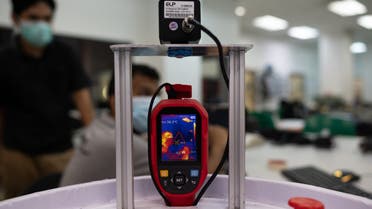 A temperature screening device is pictured as engineering professors program version two prototype of the IIUM Medibot medical robot, being developed for health workers to treat patients without risking infection from the coronavirus, at the International Islamic University Malaysia in Gombak, on the outskirts of Kuala Lumpur, on April 13, 2020. (AFP)