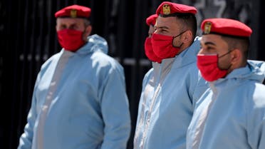 Members of Palestinian Hamas security forces wear protective gear as precaution against the coronavirus disease (COVID-19), at Rafah border crossing in the southern Gaza Strip April 13, 2020. REUTERS