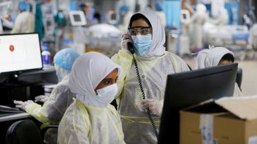 Doctors and nurses are seen doing their final check on the equipment in a makeshift ICU Field Intensive Care Unit 1 set up by Bahrian authorities to treat the coronavirus disease (COVID-19) critical patients, at a car-park of Bahrain Defence Force Hospital in Riffa. (Reuters)