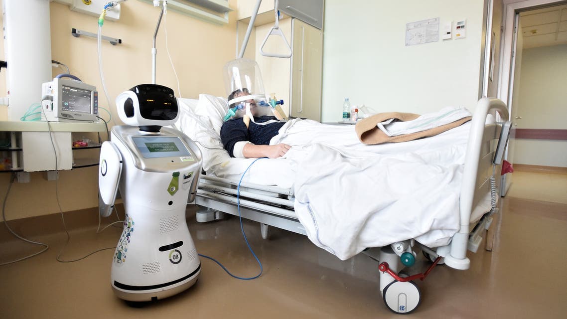 A robot helping medical teams treat patients suffering from the coronavirus disease (COVID-19) is pictured at a patient's room, in the Circolo hospital, in Varese, Italy. (Reuters)