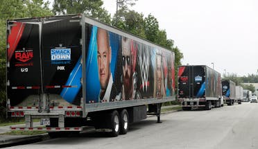 Equipment trailers are lined up at the entrance road to the WWE Performance Center Tuesday, April 14, 2020, in Orlando, Fla. (AP)