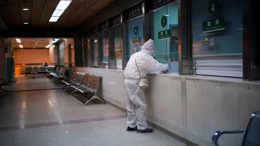 A woman wearing protective suit is seen at a hospital after the lockdown was lifted in Wuhan, capital of Hubei province and China's epicentre of the novel coronavirus. (Reuters)