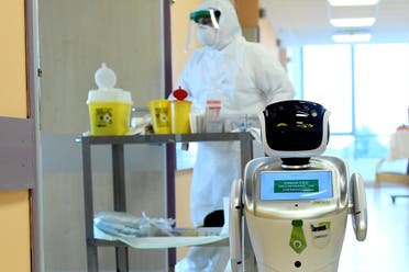 A robot helping medical teams treat patients suffering from the coronavirus disease at the Circolo hospital, in Varese, Italy. (Reuters)