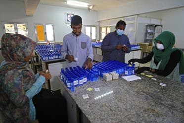 Sudanese medical laboratory students prepare sterilisers to combat the spread of the coronavirus COVID-19 in Khartoum. (AFP)