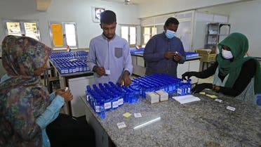 Sudanese medical laboratory students prepare sterilisers to combat the spread of the coronavirus COVID-19, on April 14, 2020 in Khartoum. (AFP)