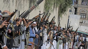 Tribesmen loyal to the Houthi rebels chant slogans as they hold their weapons during a gathering aimed at mobilizing more fighters for the Houthi movement in Sanaa, Yemen, Tuesday, Feb. 25, 2020. (AP)