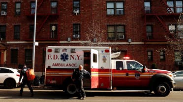 New York City Fire Department (FDNY) Emergency Medical Technicians (EMT) wearing personal protective equipment arrive to assist a woman who was having difficulty breathing during ongoing outbreak of the coronavirus disease. (Reuters)