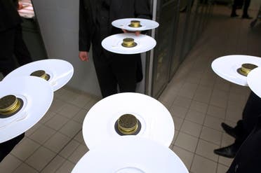 Waiters of the five-star luxury hotel Le Bristol in Paris hold plates with caviar in the hotel’s kitchen. (AFP)