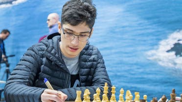 Iran's Alireza Firouzja plays against Belarus' Vladislav Kovalev during the first round of the 82nd edition of the Tata Steel Chess Tournament in Wijk aan Zee, The Netherlands, on January 11, 2020. (AFP)