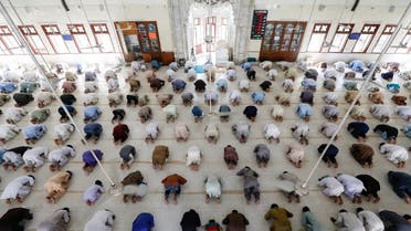 Muslims maintain safe distance as they attend Friday prayer after government limited congregational prayers and ordered to stay home, in efforts to stem the spread of the coronavirus disease (COVID-19), in Karachi, Pakistan. (Reuters)