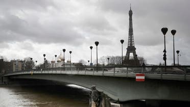 Water flows past Alma bridge by the Zouave statue which is used as a measuring instrument during floods in Paris. (AP)