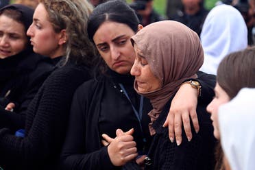 In this March 15, 2019 file photo, Iraqi Yazidi women mourn during the exhumation process of a mass grave in Iraq's northwestern region of Sinjar. (AP)