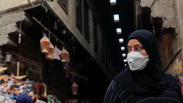 FILE PHOTO: A woman wearing a protective face mask, amid concerns over the coronavirus disease (COVID-19), looks at traditional Ramadan lanterns, called Fanous which are displayed for sale at a stall, ahead of the Muslim holy month of Ramadan at Al Khayamia street in old Cairo, Egypt April 16, 2020. (Reuters)