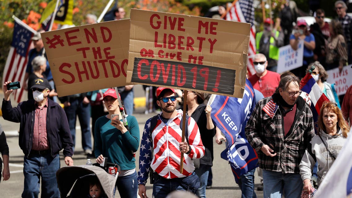Demonstrators begin to gather at a protest opposing Washington state's stay-home order to slow the coronavirus outbreak Sunday, April 1 , 2020, in Olympia, Wash. (Reuters)