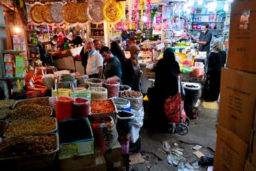 People shop in preparation for the Muslim fasting month of Ramadan, in Baghdad, Iraq, on Tuesday, April 21, 2020. (AP)