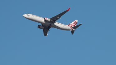A Virgin Australia Airlines plane takes off from Kingsford Smith International Airport in Sydney, Australia, March 18, 2020. (Reuters)