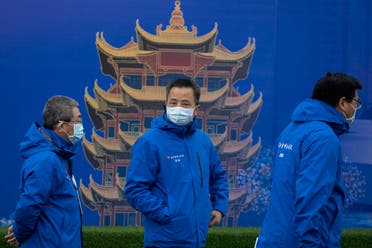 Doctors attend an outdoor press briefing at the Leishenshan Hospital which was constructed in a parking lot from prefabricated modules in two weeks in Wuhan in central China's Hubei province on April 11, 2020. (AP)