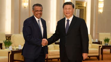 World Health Organization director general Tedros Adhanom (L) shakes hands with Chinese President Xi Jinping at the Great Hall of the People in Beijing on January 28, 2020. (AFP)