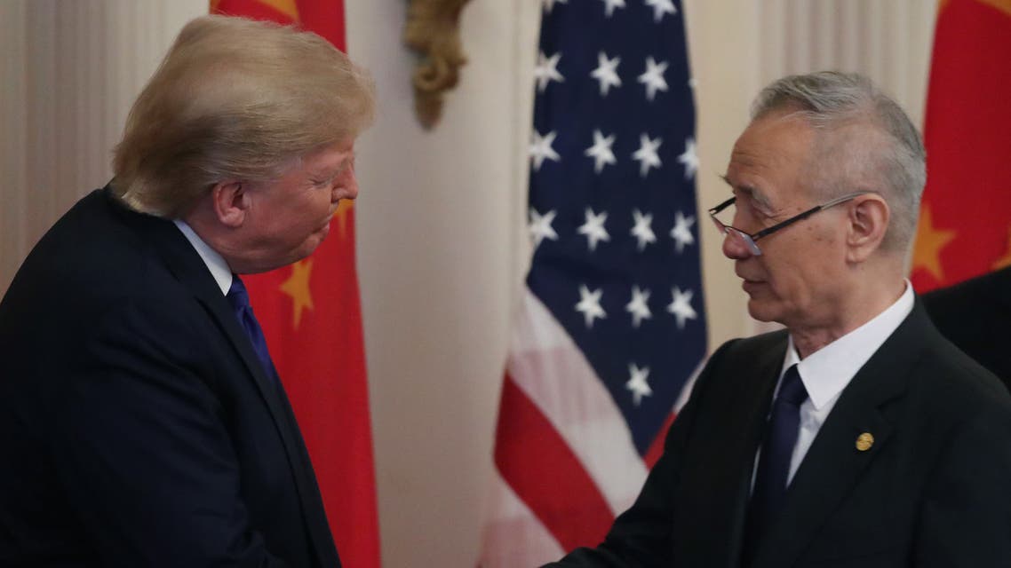 President Donald Trump shakes hands with Chinese Vice Premier Liu He, before signing the phase 1 of a trade deal between U.S. and China, in the East Room at the White House, on January 15, 2020 in Washington, DC. (AFP)