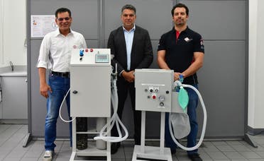 Bahrain International Circuit engineers pictured with one unit of the newly designed breathing aid. (BNA)