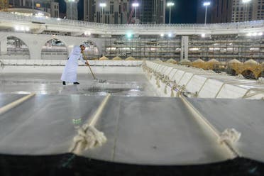 The General Presidency for the Affairs of the Two Holy Mosques's team cleans and sterilizes the cover (Kiswa) and surface of the Holy Kaaba in Mecca, Saudi Arabia, April 21, 2020. (Twitter) 6