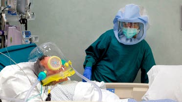 A nurse tends to a patient in the intensive care unit of the COVID-19 department of the Policlinic of Tor Vergata in Rome on April 17, 2020. (AP)