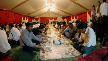 Muslim labourers and workers prepare to break their fast, during the Muslim Holy month of Ramadan, in a charity tent set up to offer free iftar meals to poor working labourers in one of the residential areas in Dubai, UAE. (File photo: Reuters)