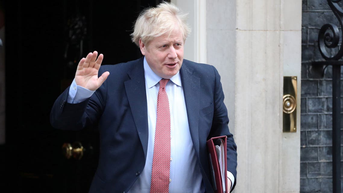 FILE PHOTO: Britain's Prime Minister Boris Johnson waves as he leaves Downing Street, as the spread of coronavirus disease (COVID-19) continues. London, Britain, March 25, 2020. REUTERS/Hannah Mckay/File Photo