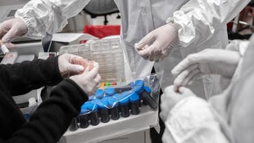 NEW YORK, NY - APRIL 10: Mirimus, Inc. lab scientists sort through COVID-19 samples from recovered patients on April 10, 2020 in the Brooklyn borough of New York City. Misha Friedman/Getty Images/AFP 