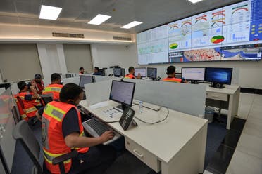 Employees of the COVID-19 coronavirus disease operations room of the Saudi Red Crescent (SRC) are seen while on duty in the Saudi capital Riyadh, on April 6, 2020. The SRC increased their employees to meet the increased demand on ambulances since the novel coronavirus appeared and the kingdom imposed a curfew. (File photo)