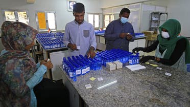 Sudanese medical laboratory students prepare sterilisers to combat the spread of the coronavirus COVID-19, on April 14, 2020 in Khartoum. 