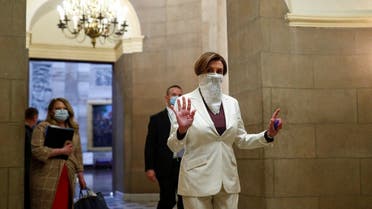 US Speaker of the House Nancy Pelosi (D-CA) wears a face mask as she walks to the House Chamber ahead of a vote on an additional economic stimulus package passed earlier in the week by the US Senate. (Reuters)