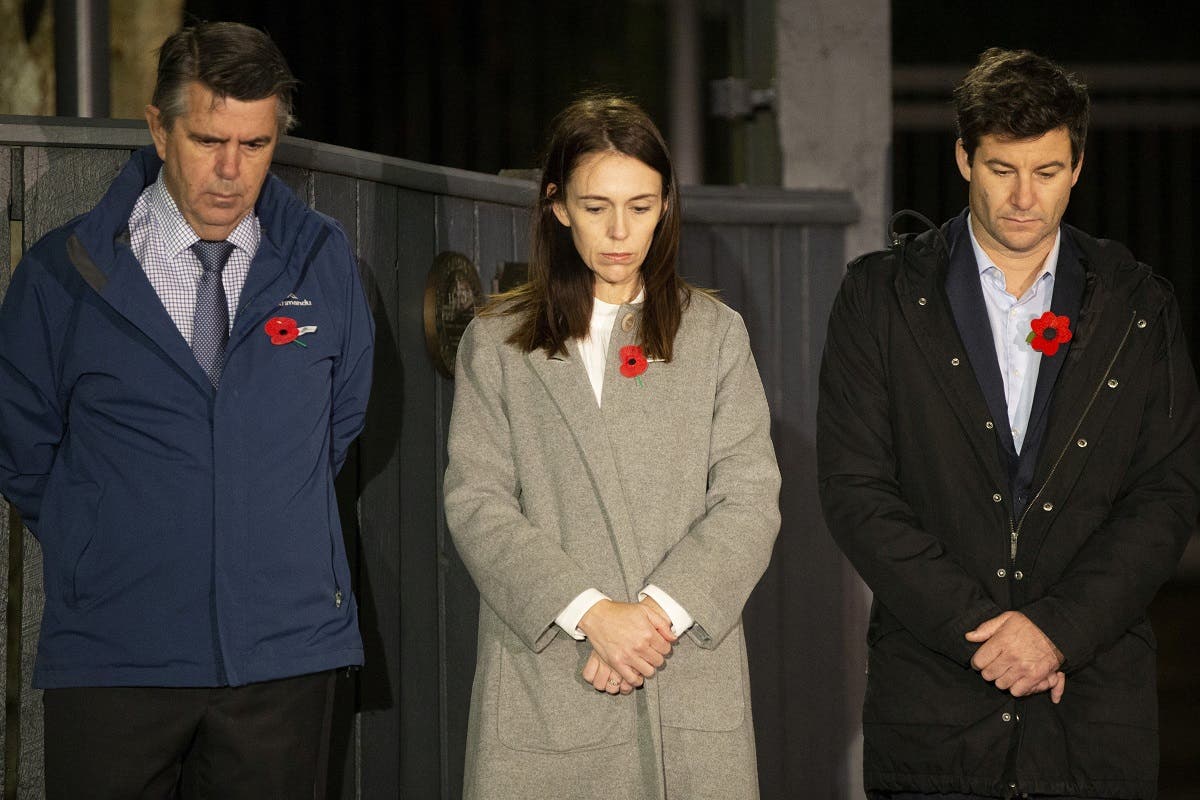 Prime Minister Jacinda Ardern stands at dawn on the driveway of Premier House with her father Ross Ardern (L) and partner Clarke Gayford, in Wellington, New Zealand. (Reuters)