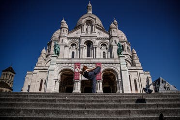 Yara al-Hasbani performs a dance in front of the Sacre Coeur Basilica in Paris on April 22, 2020. (AFP)