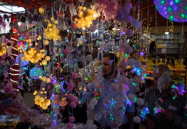 Palestinians buy festive lights in the Zawiya market ahead of the holy month of Ramadan, in Gaza City, on Wednesday, April 22, 2020. (AP)