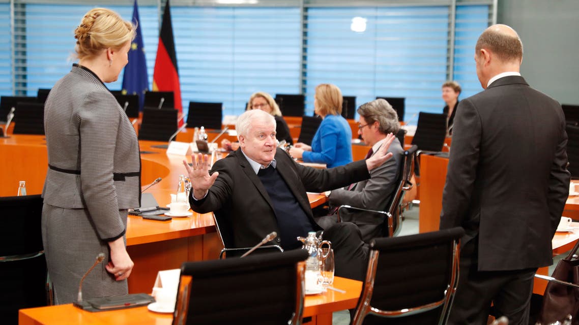 German Interior Minister Horst Seehofer, center, gestures to Finance Minister Olaf Scholz, right, and Minister for Family Affairs, Senior Citizens, Women and Youth Franziska Giffey in Berlin, Germany on March 23, 2020. (AP)