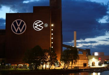 A cartoon of a VW logo squashing the coronavirus is displayed on a building at Volkswagen’s headquarters to celebrate the plant’s re-opening during the spread of the coronavirus in Wolfsburg, Germany. (Reuters)