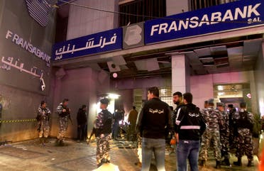  Lebanese security forces inspect the entrance of Fransabank branch in Lebanon’s southern city of Sidon after the attack on April 25, 2020. (AFP)