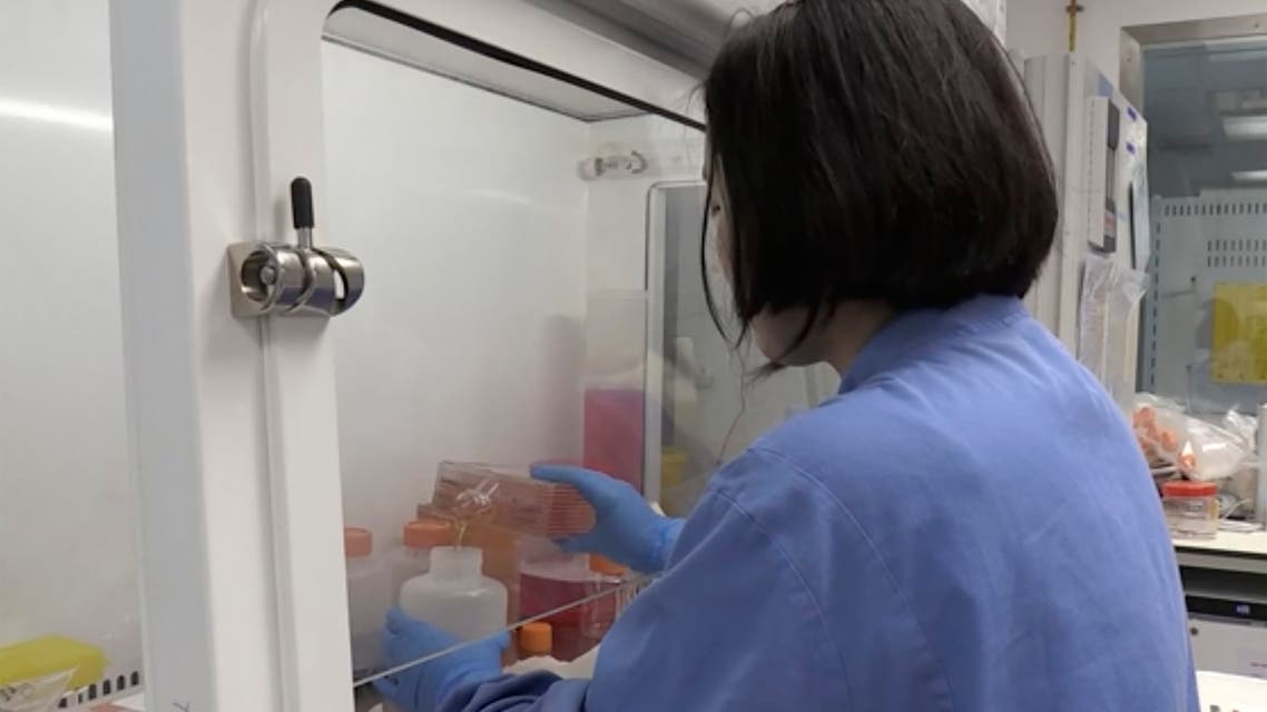 Screen grab taken from video issued by Britain's Oxford University, showing a person working inside the lab working on a potential COVID-19 coronavirus vaccine, untaken by Oxford University in England, Thursday April 23, 2020.