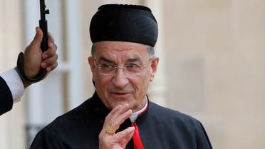 Patriarch Bechara Boutros Rai of Lebanon waves to the media as he walks out after his meeting with French President Francois Hollande, unseen, at the Elysee Palace, in Paris, Tuesday, April 9, 2013. (AP)
