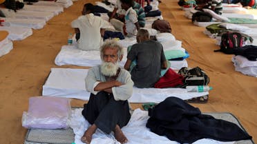 People rest at a shelter set up for migrant workers from other Indian states affected by the coronavirus lockdown in Mumbai, India, Monday, April 6, 2020. (AP) 